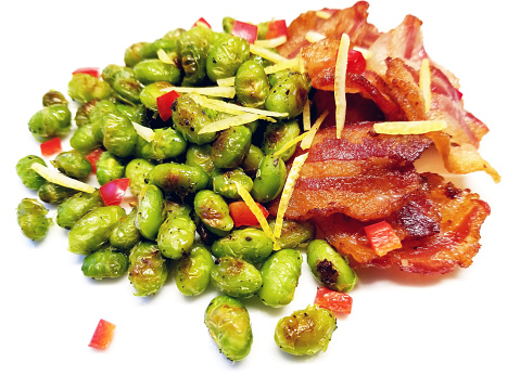 Fried bacon served with pan fried edamame (soy beans)