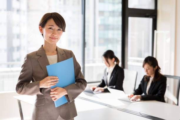 istock asian businesswomen working in office 941997608