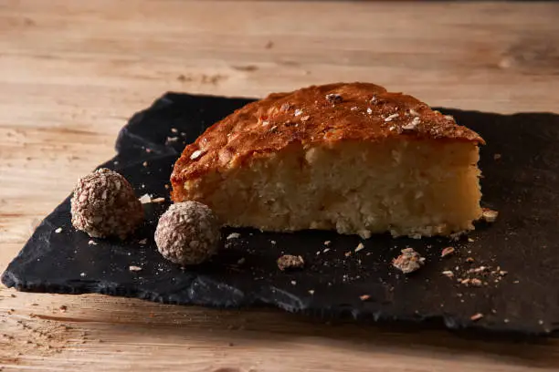 Photo of Delicious slice of freshly baked apple pie on shale board