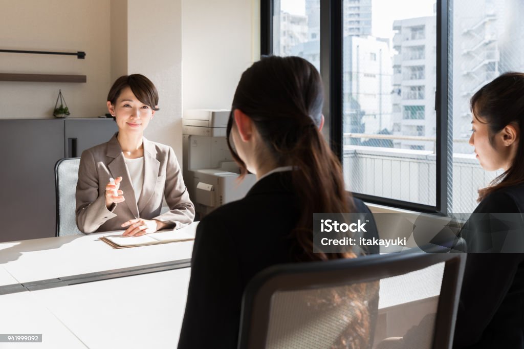 asian businesswomen working in office Interview - Event Stock Photo