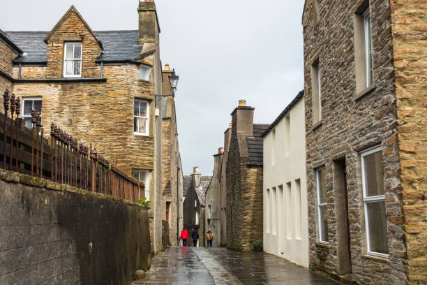 istock Walking in Stromness, a typical small town in Orkney Islands, Scotland, Britain 942002614