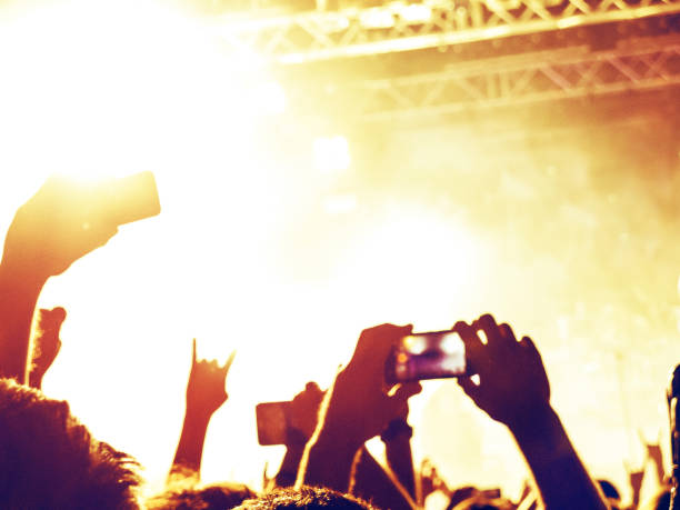 istock Concert stage in a crowded venue 942005200