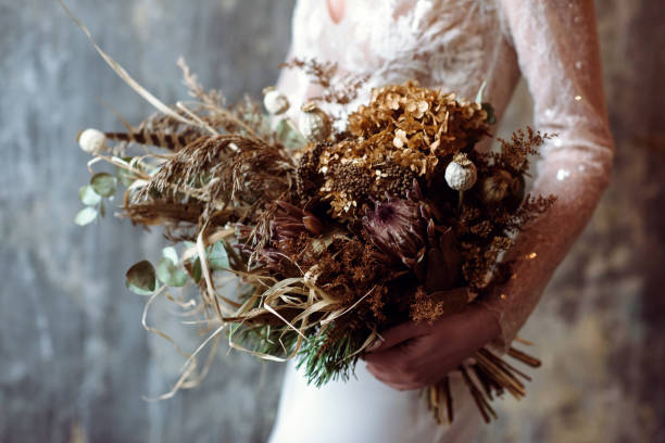 istock Beautiful bride is holding a wedding colorful bouquet 942116038