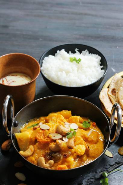 istock Vegetable or Navratan Korma - Indian Mixed Veg Curry served with Roti and rice 942116106
