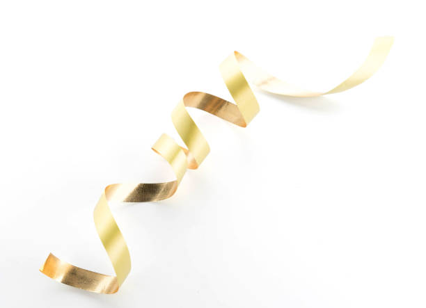 istock Golden ribbon roll isolated on white background 942116132
