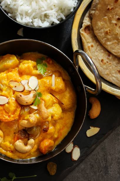 istock Vegetable or Navratan Korma - Indian Mixed Veg Curry served with Roti and rice 942116162