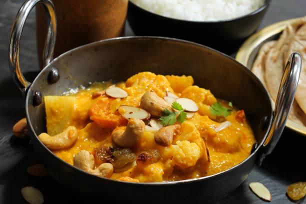 istock Vegetable or Navratan Korma - Indian Mixed Veg Curry served with Roti and rice 942116408