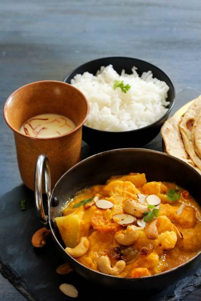 istock Vegetable or Navratan Korma - Indian Mixed Veg Curry served with Roti and rice 942116742