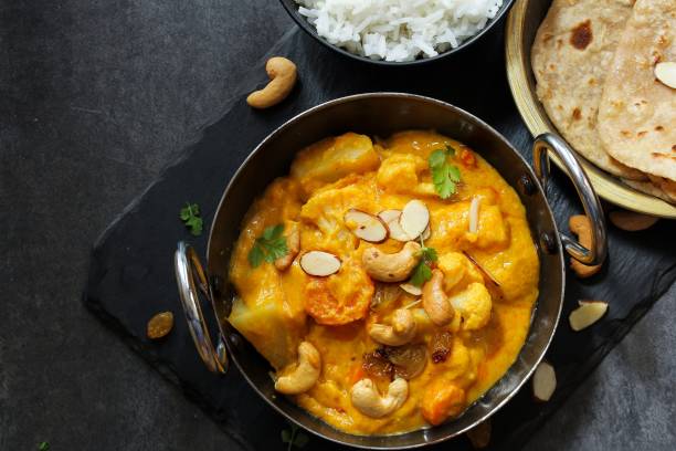 istock Vegetable or Navratan Korma - Indian Mixed Veg Curry served with Roti and rice 942117132