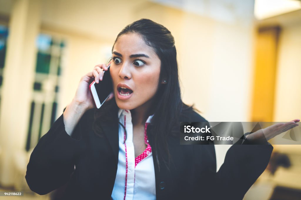 Business Woman talking using her mobile phone Asian business woman Customer Service Representative Stock Photo