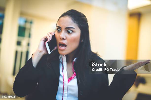 Business Woman Talking Using Her Mobile Phone Stock Photo - Download Image Now - Customer Service Representative, Anger, Displeased