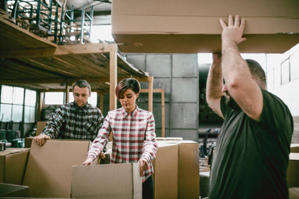 istock Coworkers Packing Their Products for Shipping in their Workshop 942120100