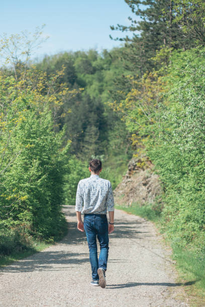istock Beautiful young man enjoying in nature on the spring day 942121274