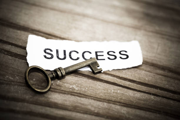 istock Key with success written on paper 942123678