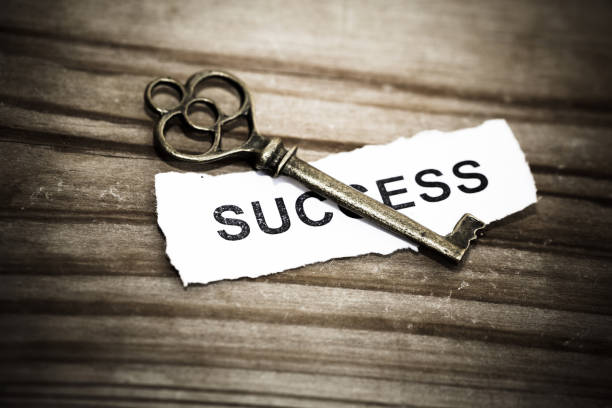istock Key with success written on paper 942123682