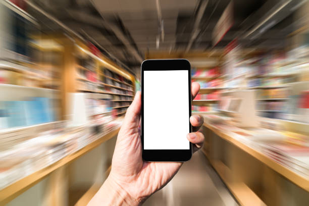 istock Choice books with mobile in bookstore 942124040