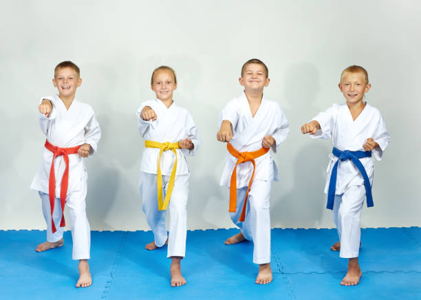 istock Four athlete are beating punch arm 942129294