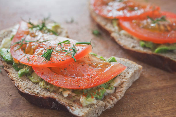 istock Avocado and tomato on sourdough toast 942130636