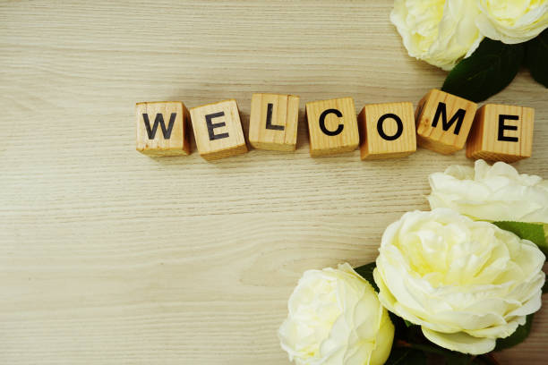 istock welcome wooden word text with space copy on wooden background; 942131086