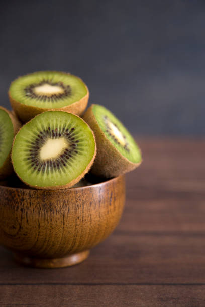 istock Sliced Kiwi Fruit on a Wooden Table 942131478