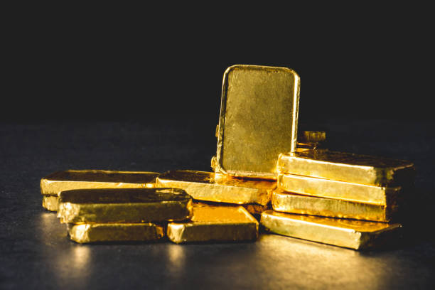 istock Stack of Pure gold bars on black background 942136912