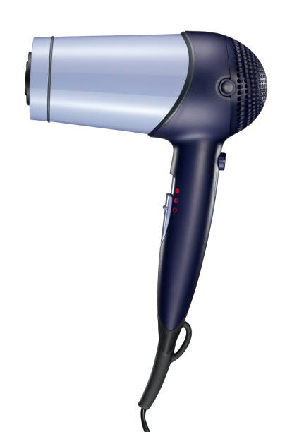 Young caucasian woman girl is blow drying her long hair using electric hair dryer with happy smiling face