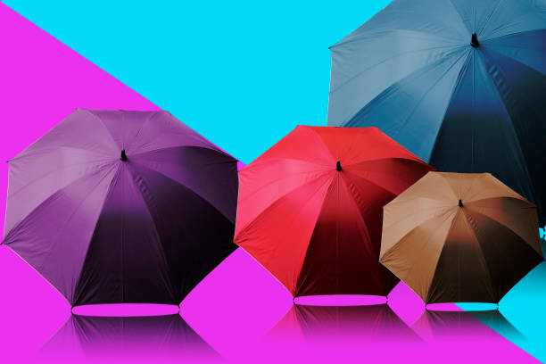istock umbrella colorful on color background 942141278