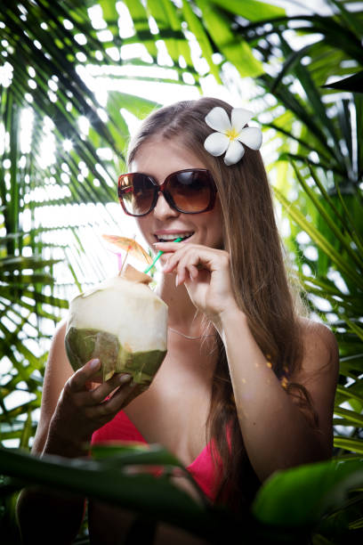 istock girl with cocktail 942142868
