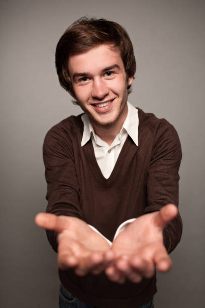 istock portrait of a young man in a studio on a gray background 942143520