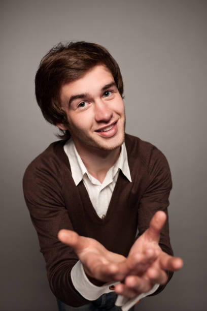 istock portrait of a young man in a studio on a gray background 942143530