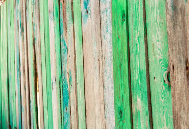 Backgrounds and texture concept - Color wooden fence from boards. selective focus