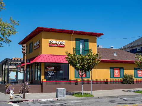BERKELEY, CA - April 1, 2018: Popeyes fast food restaurant in Berkeley, California. Popeyes serves fried chicken.