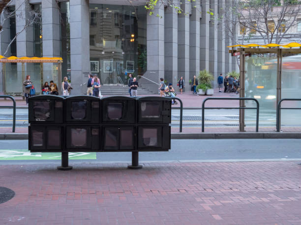 Empty newsstand machine in downtown San Francisco SAN FRANCISCO, CA - MARCH 30, 2018: Empty newsstand machine in downtown San Francisco. This reflects the continuing downward trend of print media. paper dispenser stock pictures, royalty-free photos & images