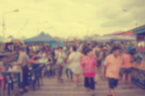 istock Abstract blurred people walking at the market. 942146400