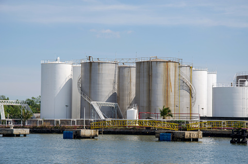 Gas storage tanks and oil tank in industrial factory plant.