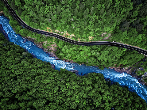 Mountain river and road aerial view