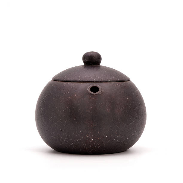 istock Retro clay Chinese teapot isolated on a white background. small earthenware 942147608