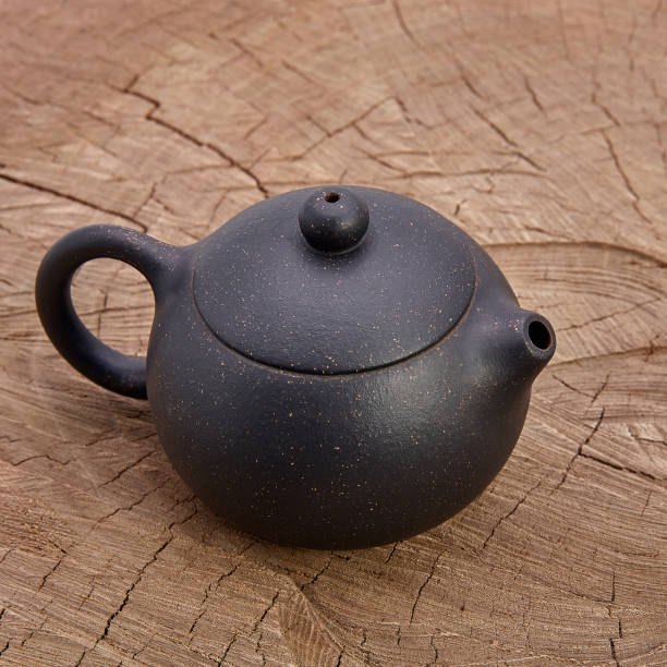 istock Retro clay Chinese teapot on wooden background 942147792