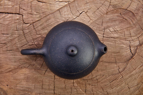 istock Retro clay Chinese teapot on wooden background 942147836