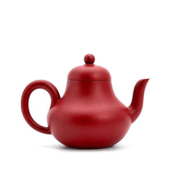 istock small earthenware teapot, bowl and tea on white background 942147838