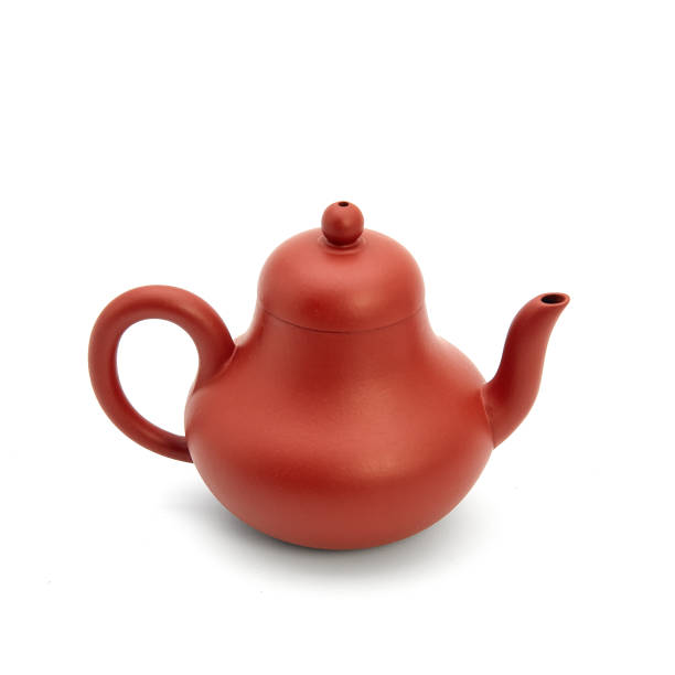 istock small earthenware teapot, bowl and tea on white background 942147856