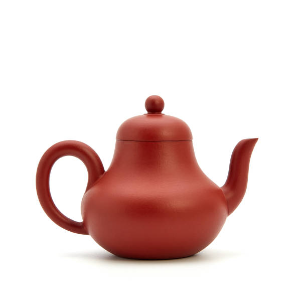 istock small earthenware teapot, bowl and tea on white background 942147858