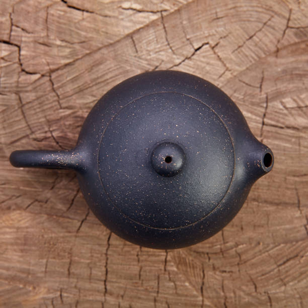 istock Retro clay Chinese teapot on wooden background 942147882