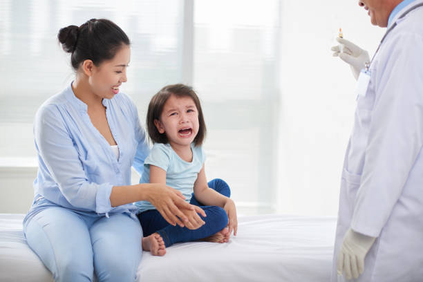 istock Crying Little Girl at Doctors Office 942149166
