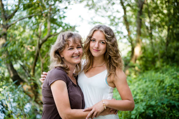 istock Mother and daughter hugging each other with love 942150448