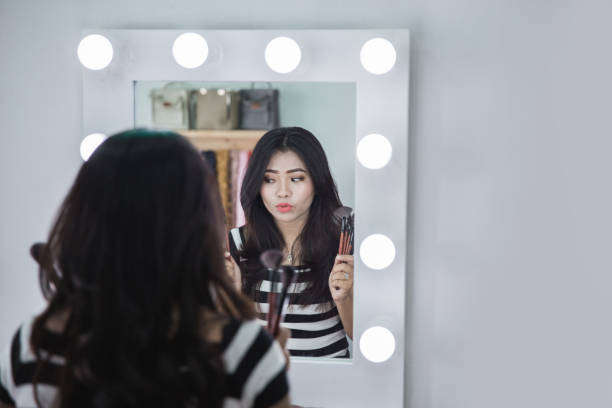 istock woman holding some make up brush 942150838