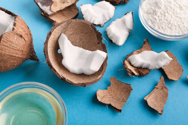 istock Plate with coconut flour and water on blue background 942151362
