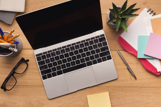 istock Male workplace with laptop top view 942152048