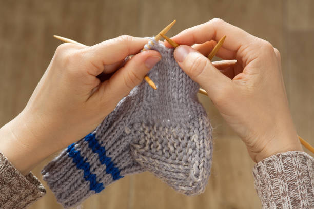 istock woman hands knitting a sock 942152644