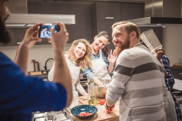 istock Chef is photographing attendees of cooking class 942153632